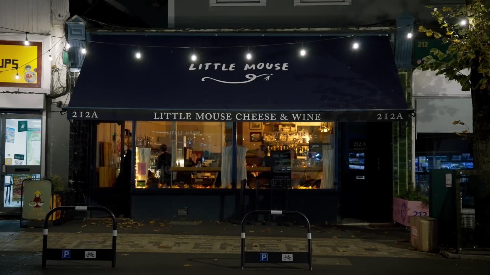 The Little Mouse shopfront at night